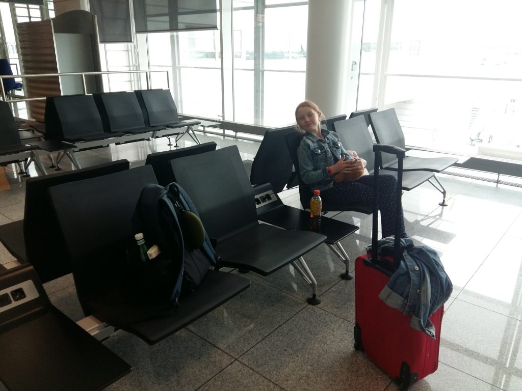 Gracie sitting in the empty gate at Munich airport